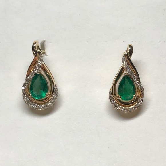 14K yellow gold, emerald and diamond post earrings.